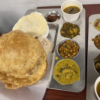 Sri Ganesh Dosa House signature dishes Idly, Vada, Masala Dosa ComboSouth Indian Vegetarain ThaliSteam Idli